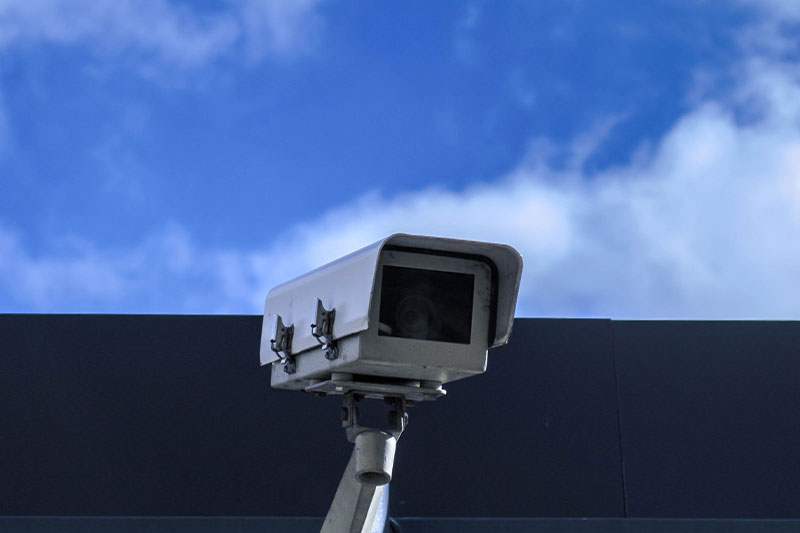 Outdoor security camera mounted on a building wall