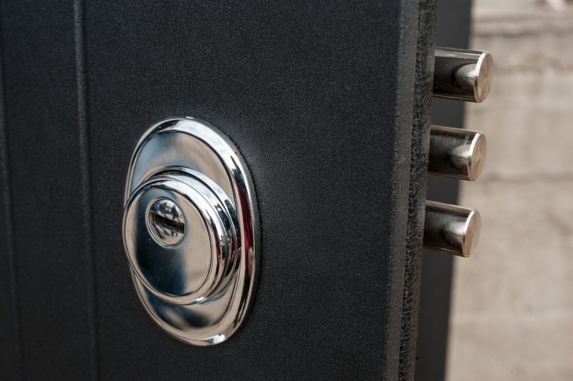 High-security lock cylinder and bolts on a steel entry door