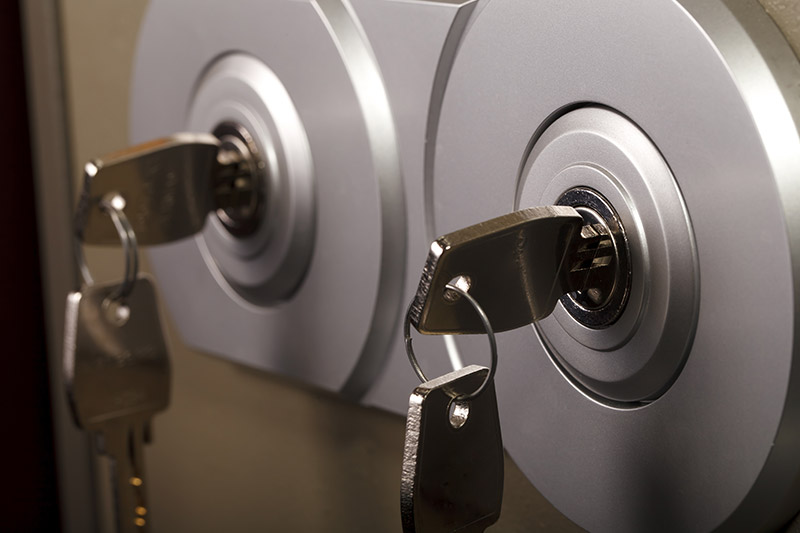 Keys in the locks of a steel safe